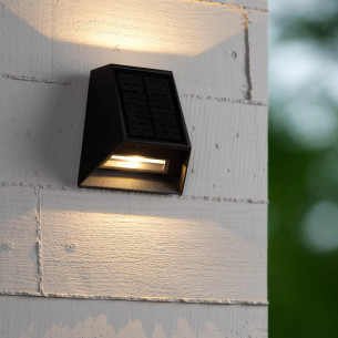 Luton LED black solar wall lamp with twilight sensor Lucide