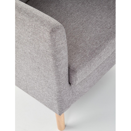 Clubby grey upholstered armchair with wooden legs Halmar