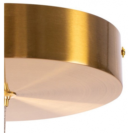 Designerska Lampa mosiężna wisząca Circle LED 40 Step Into Design nad stół.